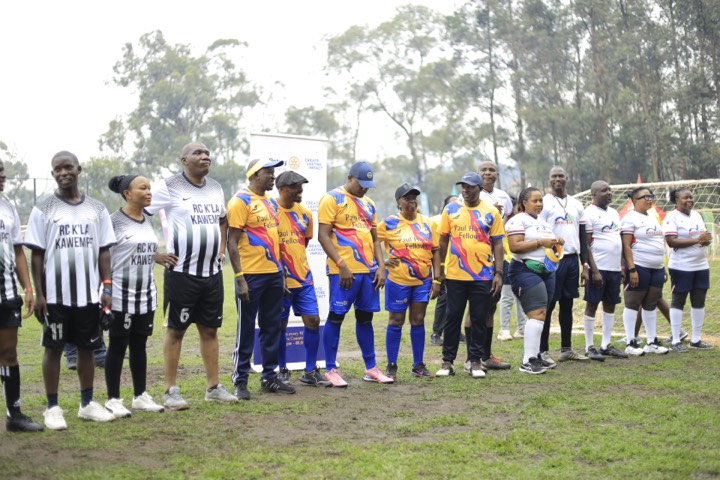 Teams lined up on the pitch